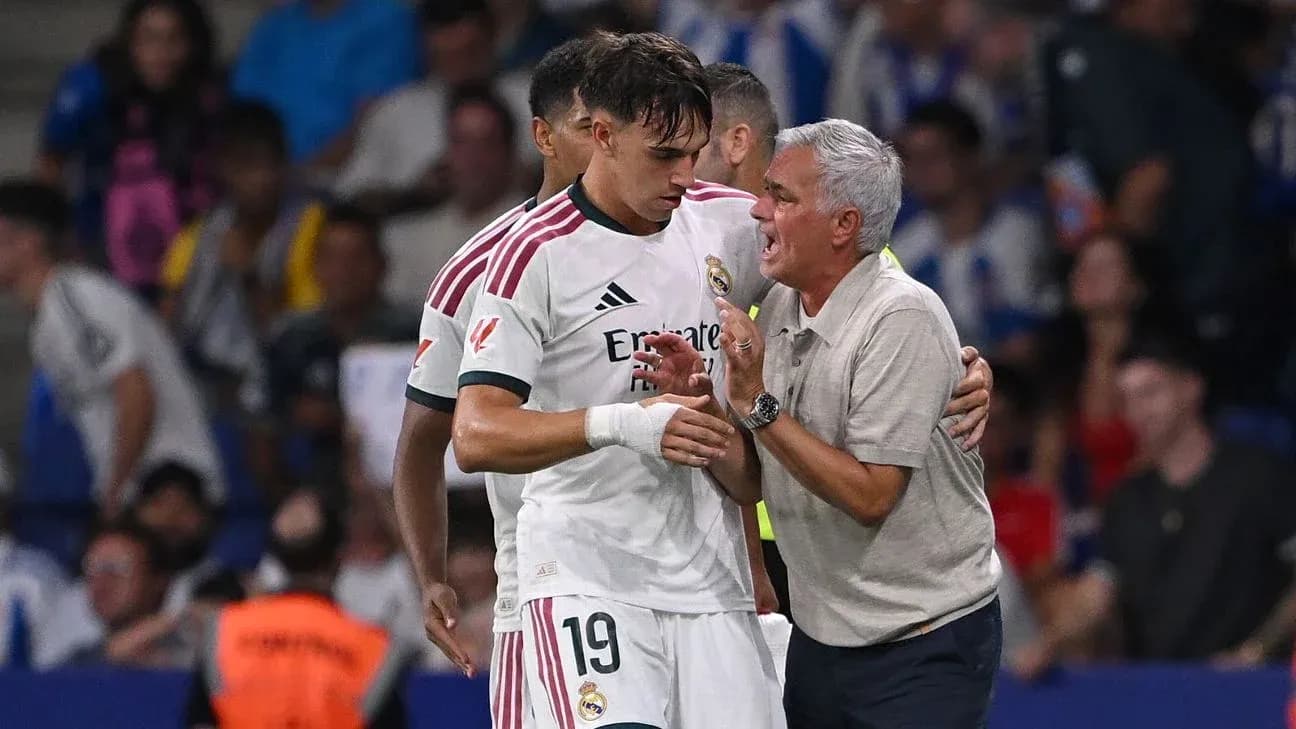 Coach speaking with player during match stoppage Coach speaking with player during match stoppage