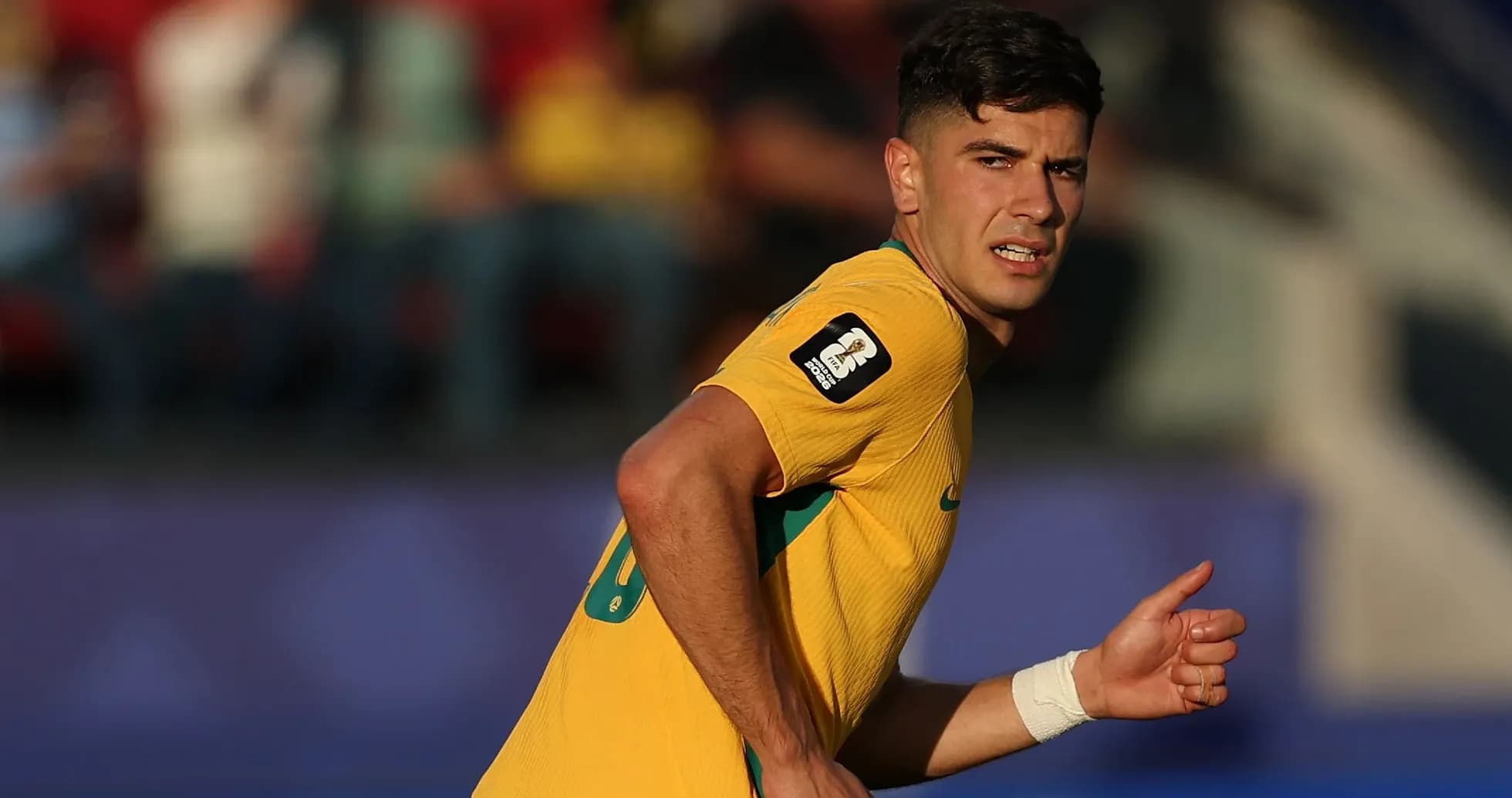 Player in yellow jersey running on the field Player in yellow jersey running on the field