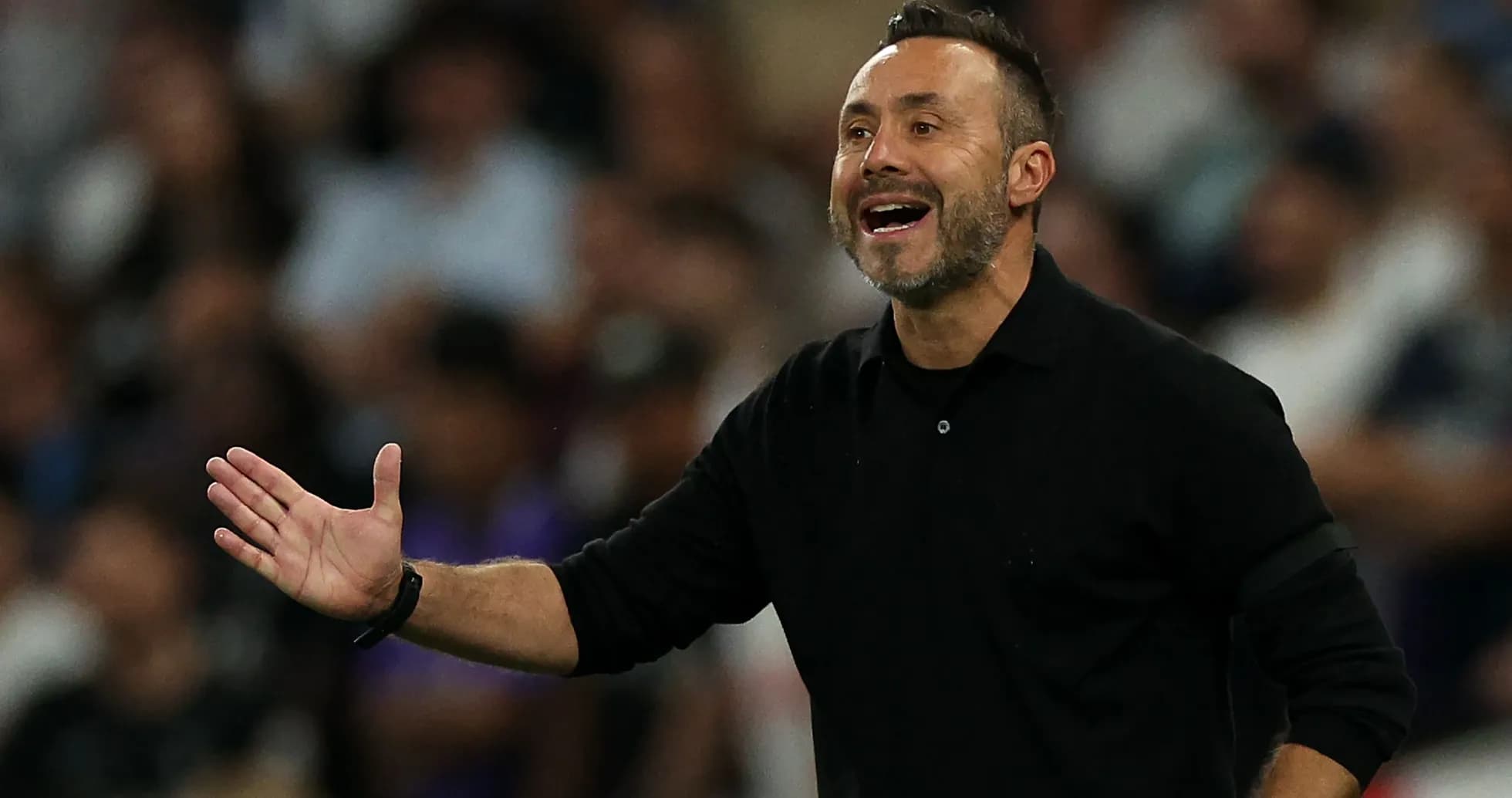 Manager gesturing during a match from the sidelines Manager gesturing during a match from the sidelines