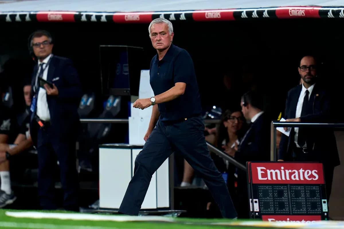 Coach walking along the sideline during match Coach walking along the sideline during match