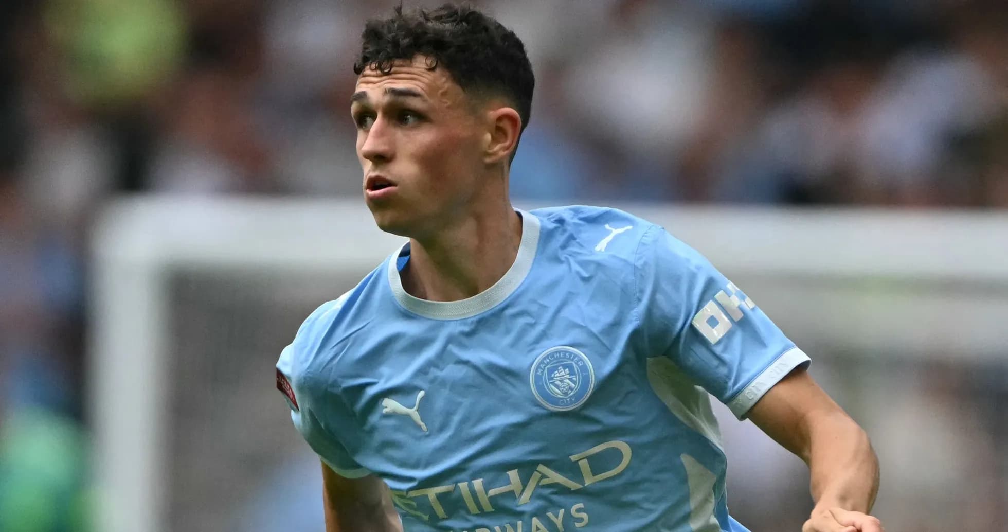 Phil Foden running on the pitch during match Phil Foden running on the pitch during match