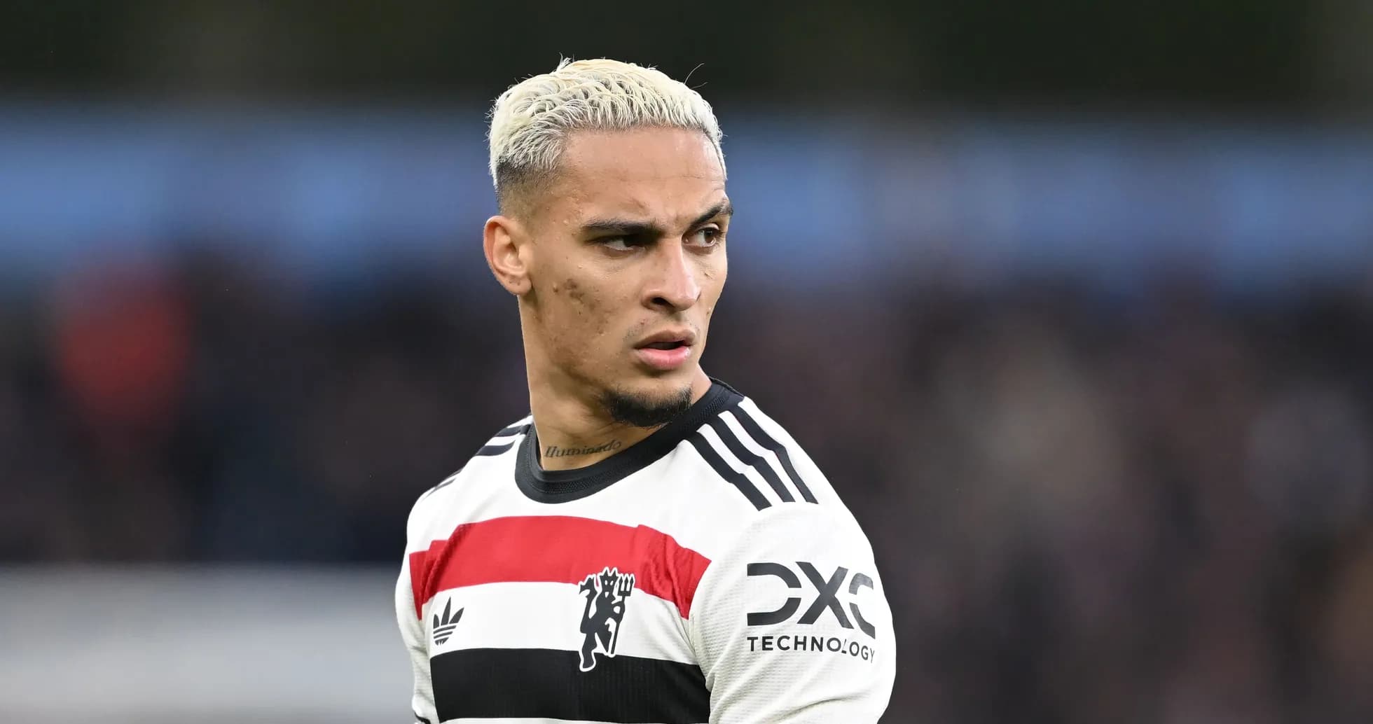 Player wearing Manchester United jersey on field Player wearing Manchester United jersey on field