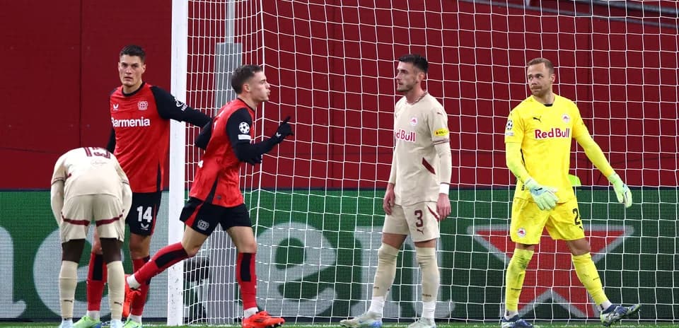 Bayer Leverkusen players celebrating a goal Bayer Leverkusen players celebrating a goal