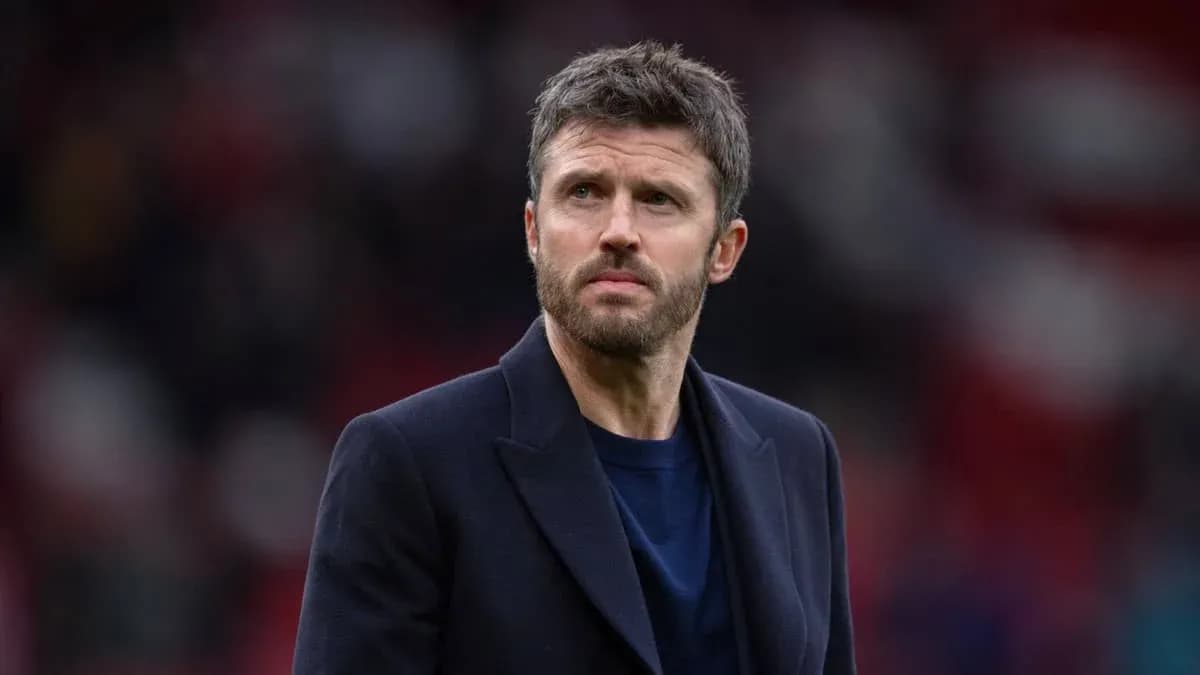 Man in a coat on a football pitch Man in a coat on a football pitch