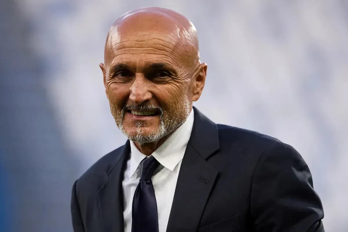Coach smiling in formal suit at stadium Coach smiling in formal suit at stadium
