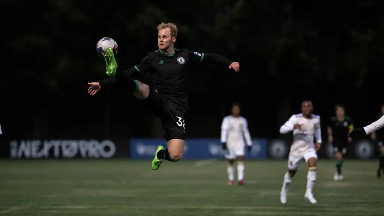 Goalkeeper making a save during match Goalkeeper making a save during match
