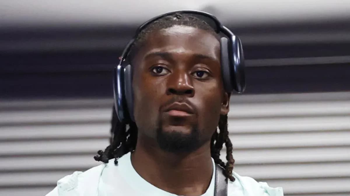 Athlete wearing headphones in a hallway Athlete wearing headphones in a hallway