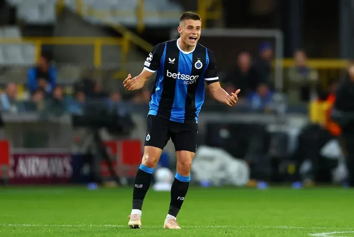 Player in blue and black kit gesturing during match Player in blue and black kit gesturing during match