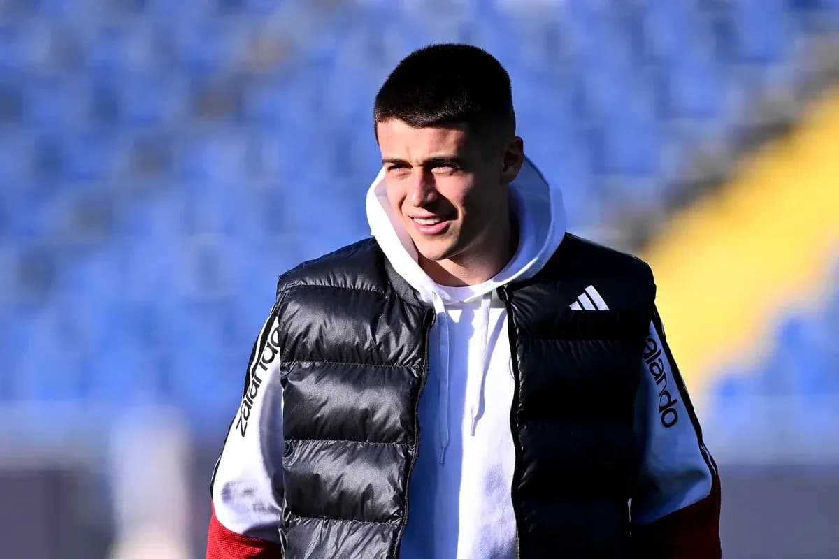 Player in puffer vest at training ground Player in puffer vest at training ground