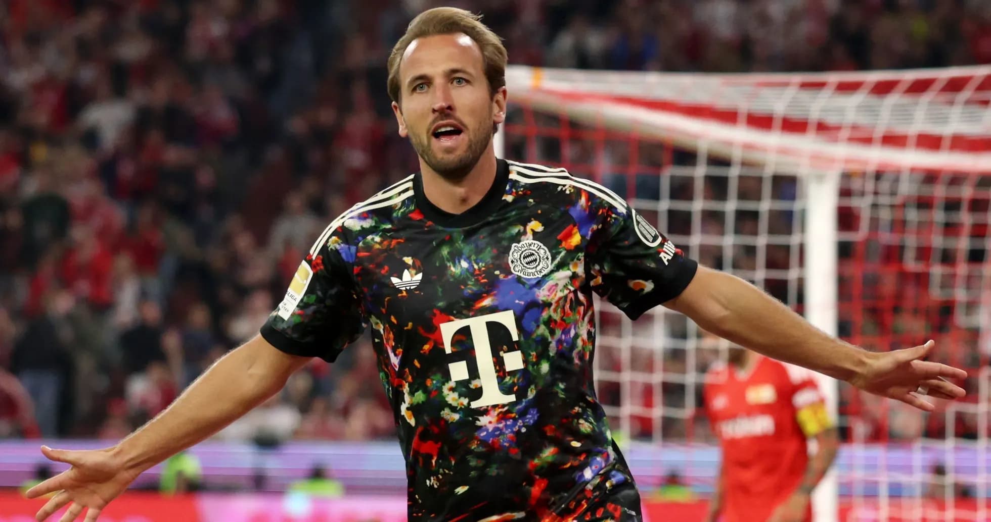 Player celebrating a goal in colorful jersey Player celebrating a goal in colorful jersey