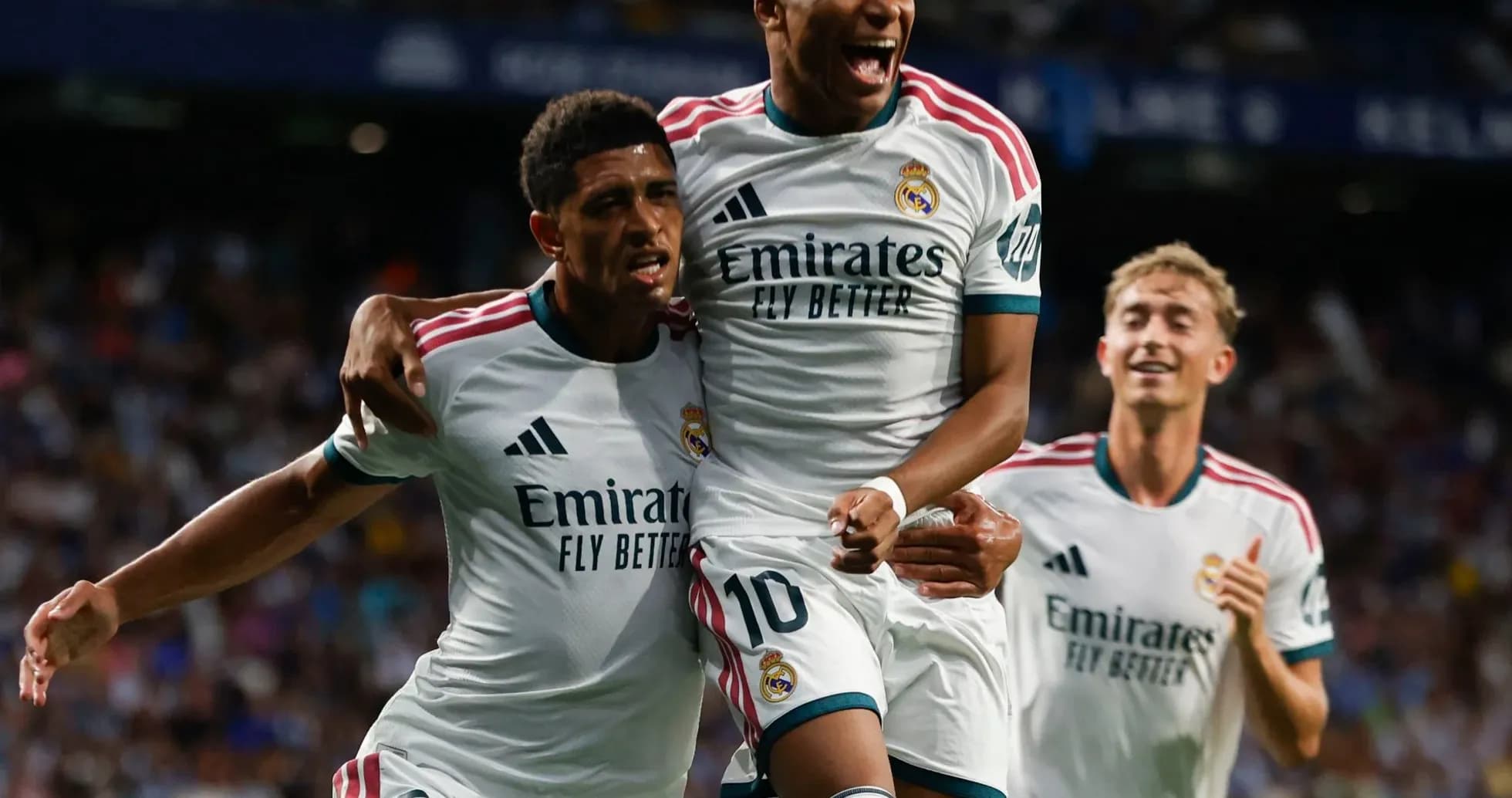 Real Madrid players celebrating a goal together Real Madrid players celebrating a goal together