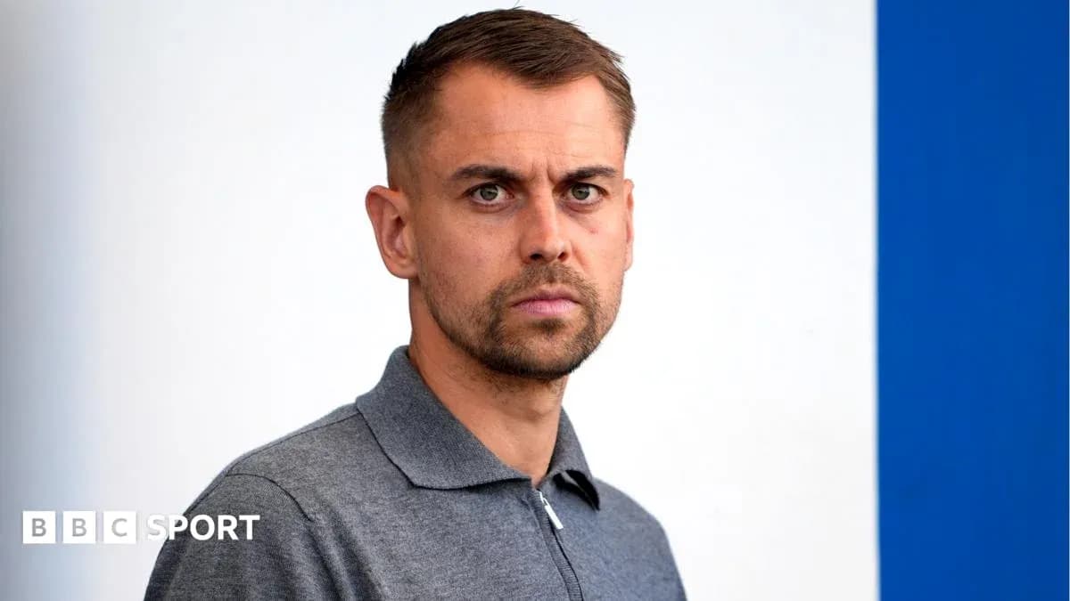 Person with short hair in gray polo shirt Person with short hair in gray polo shirt