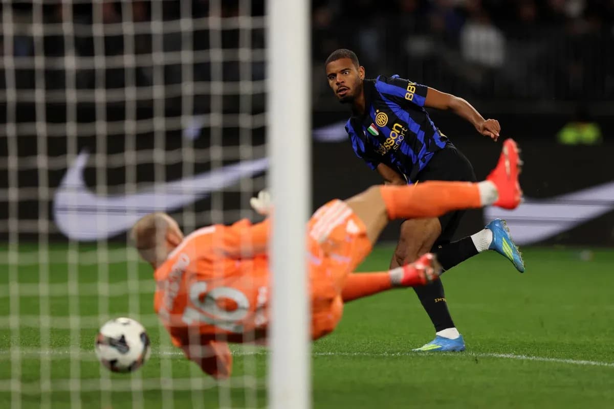 Player taking a penalty kick against the goalkeeper Player taking a penalty kick against the goalkeeper