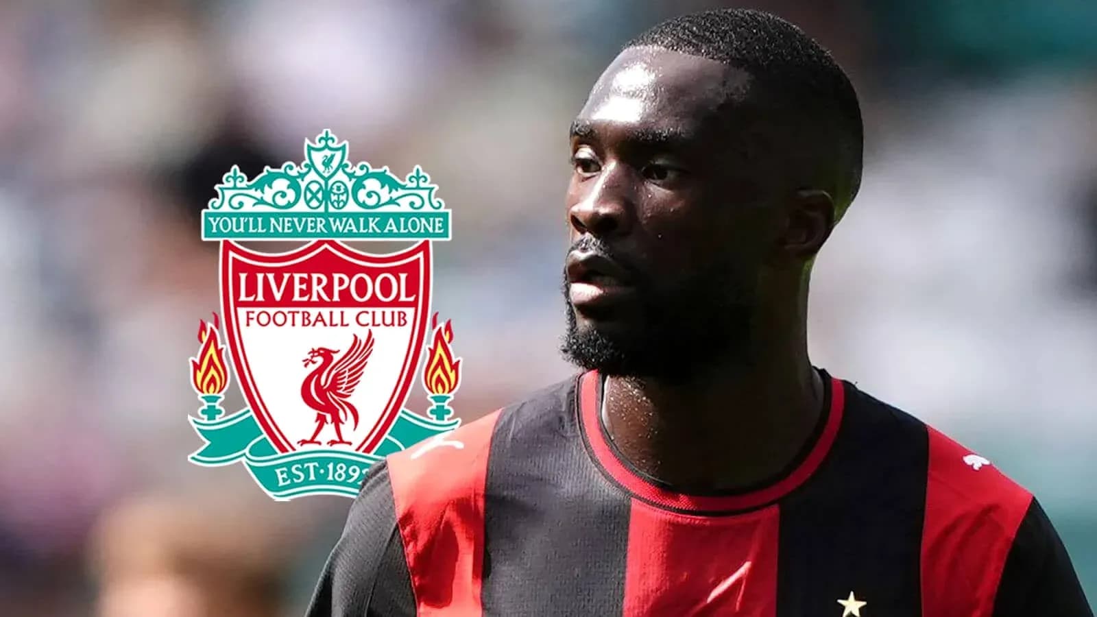 Player in black and red kit with Liverpool logo Player in black and red kit with Liverpool logo