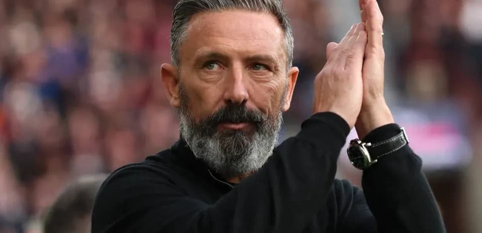 Coach applauding fans during a match Coach applauding fans during a match