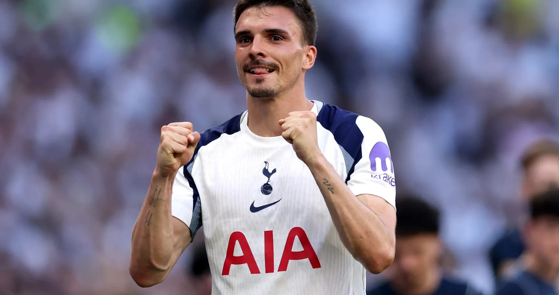 Tottenham player celebrating after scoring a goal Tottenham player celebrating after scoring a goal