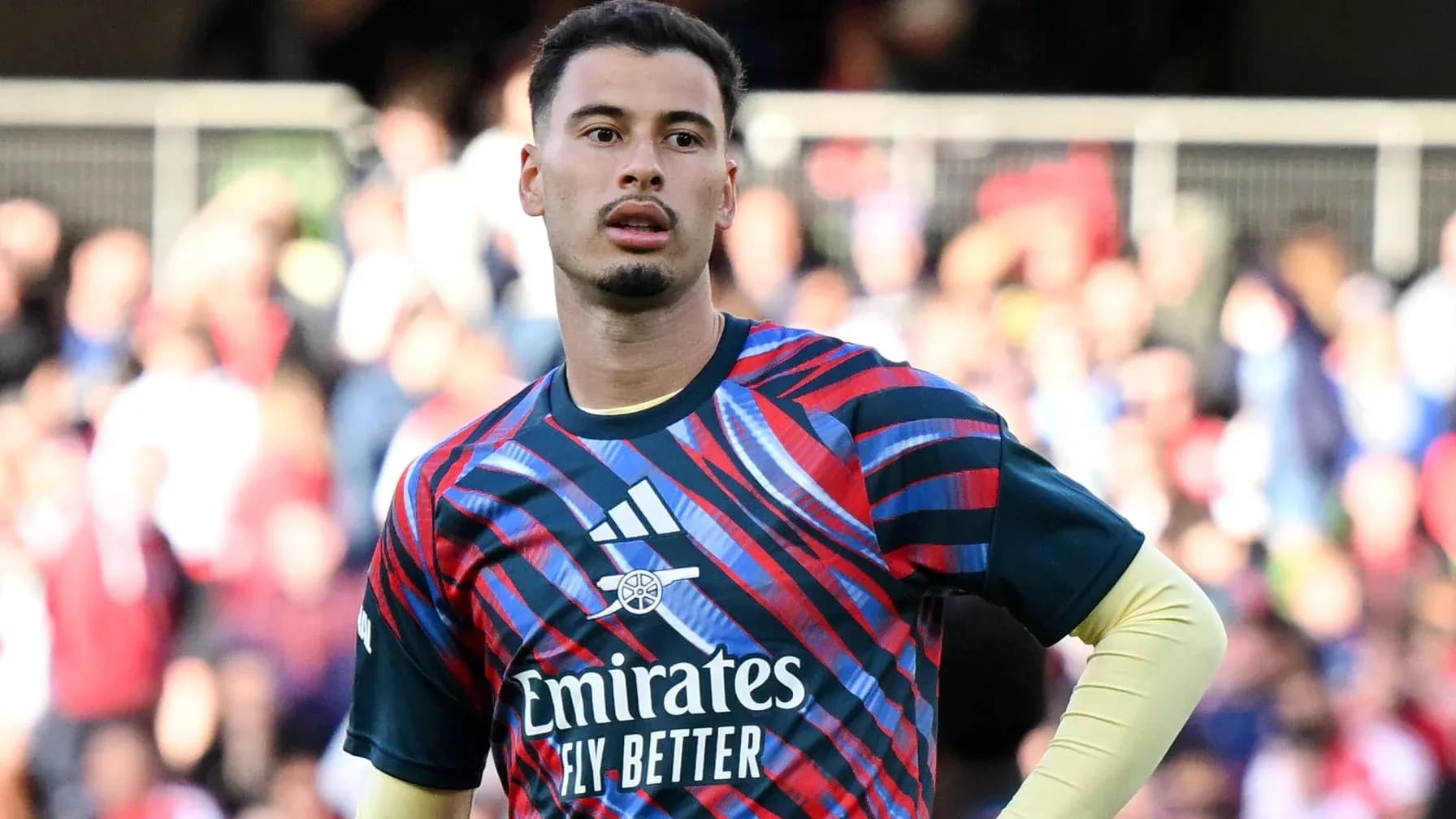 Goalkeeper in colorful training kit during match Goalkeeper in colorful training kit during match