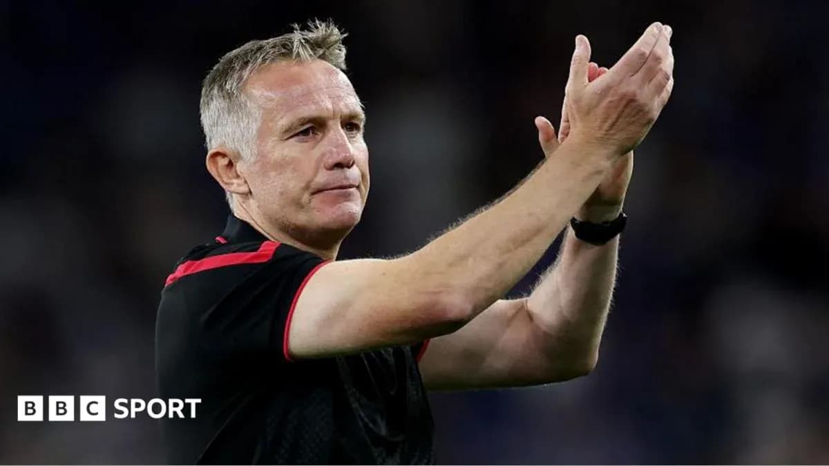 Manager applauding fans after match conclusion Manager applauding fans after match conclusion
