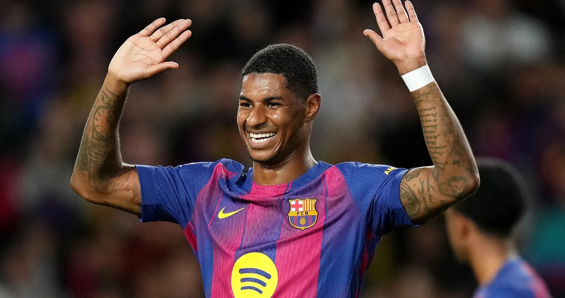 Player celebrating with raised hands in Barcelona kit Player celebrating with raised hands in Barcelona kit