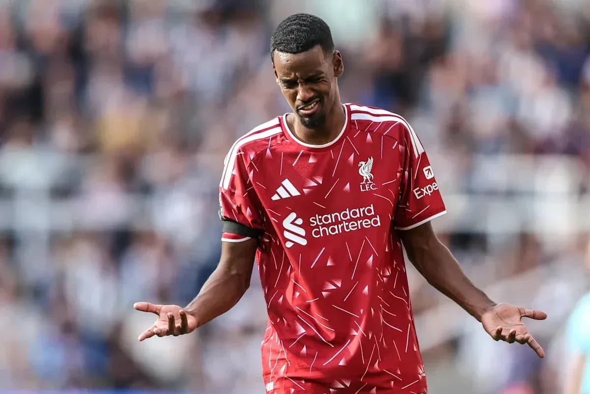 Liverpool player reacting during match with frustration Liverpool player reacting during match with frustration