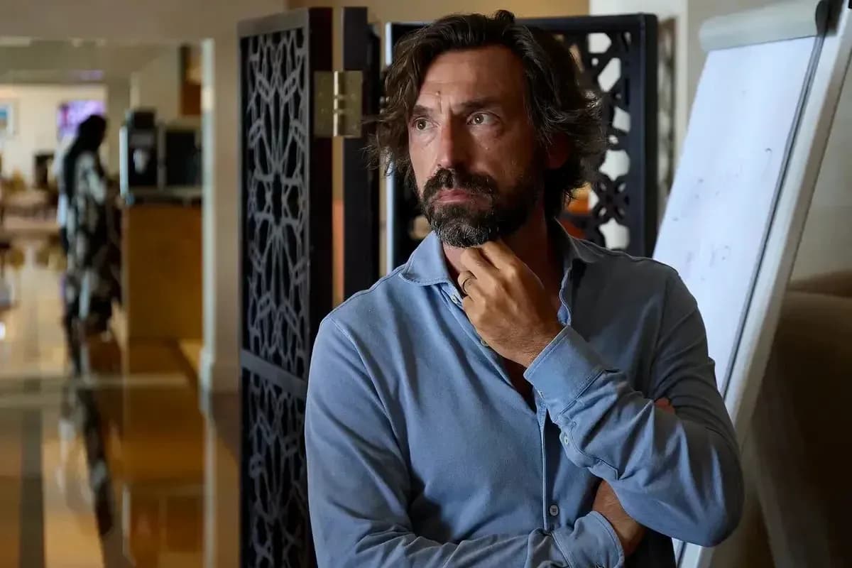 Man with beard in a blue shirt, thoughtful expression Man with beard in a blue shirt, thoughtful expression