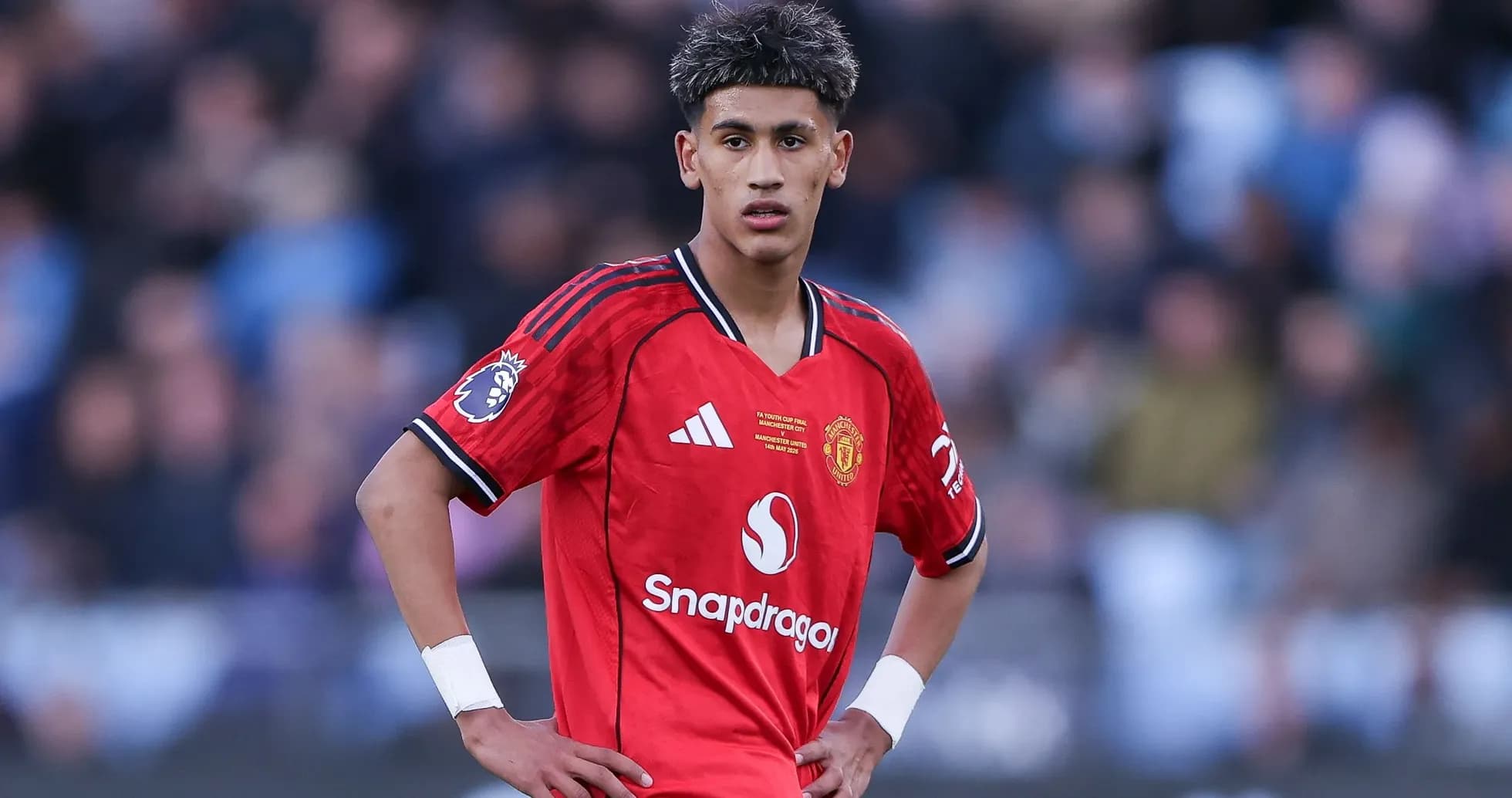 Player in red Manchester United kit on the field Player in red Manchester United kit on the field