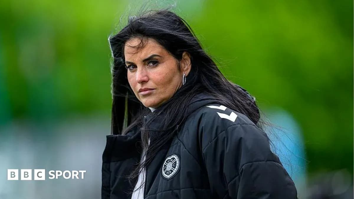 Female coach observing training session outdoors Female coach observing training session outdoors