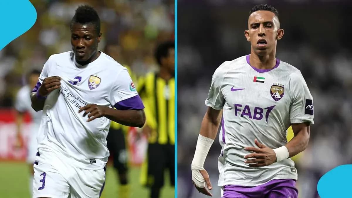 Two football players in Al Ain FC uniforms on pitch Two football players in Al Ain FC uniforms on pitch