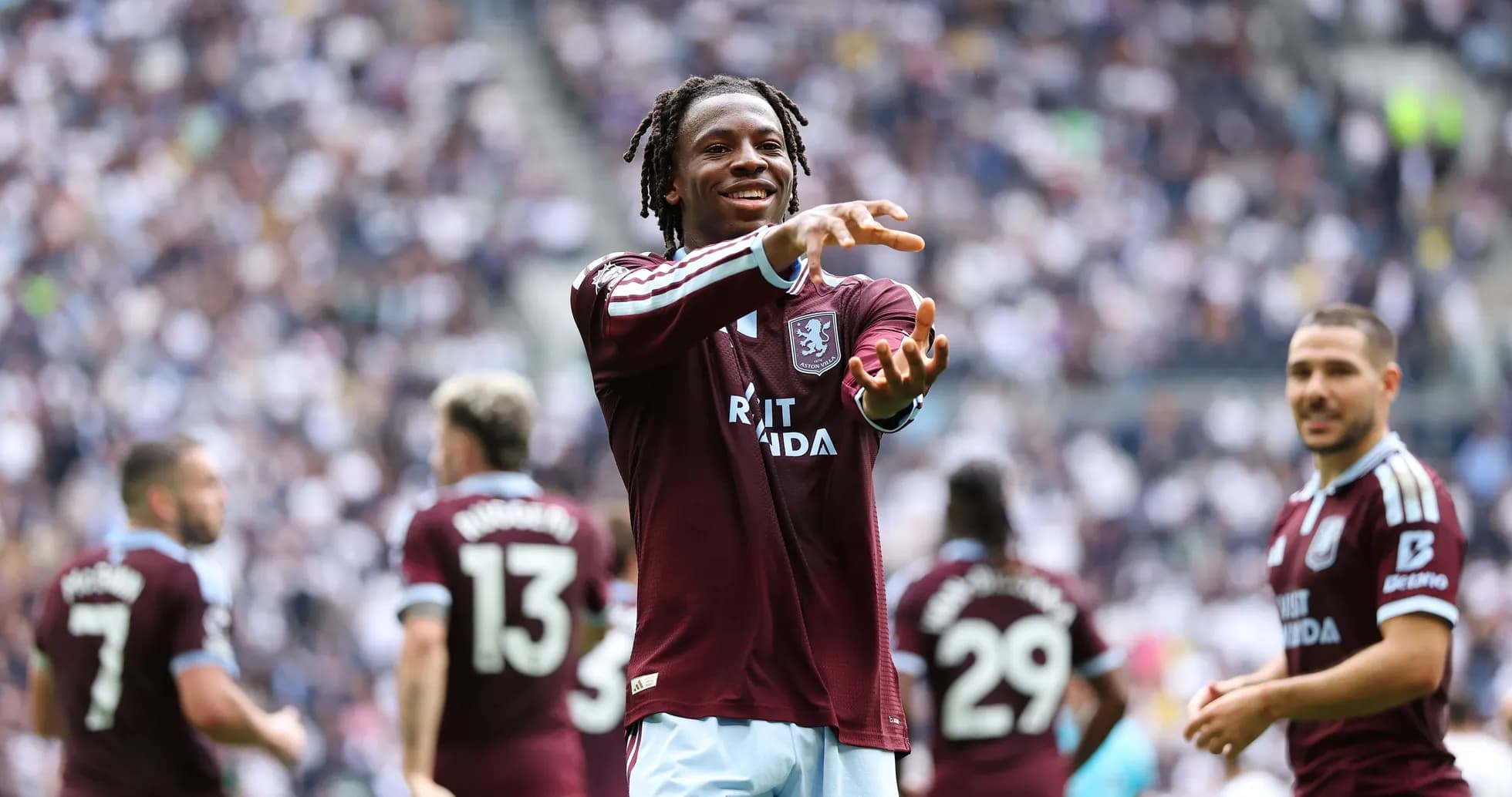 Aston Villa player celebrating on the pitch Aston Villa player celebrating on the pitch