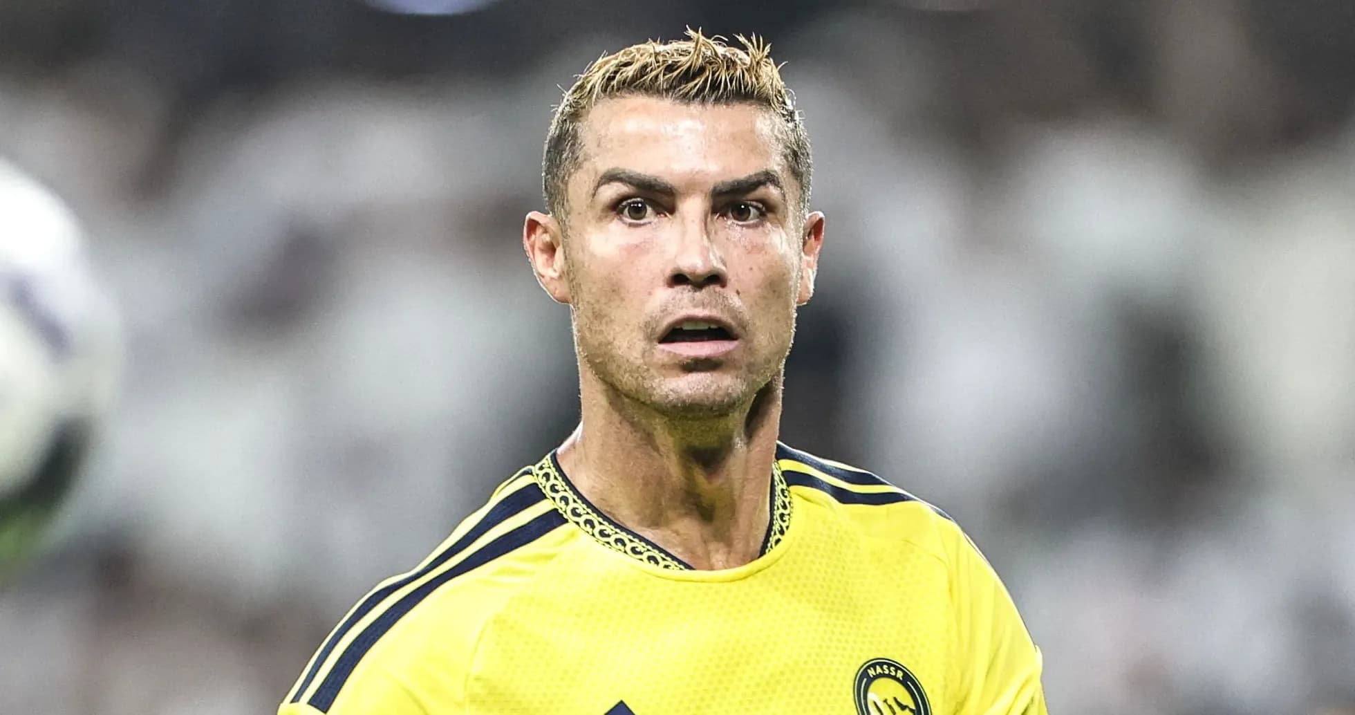 Player in yellow jersey during a match Player in yellow jersey during a match