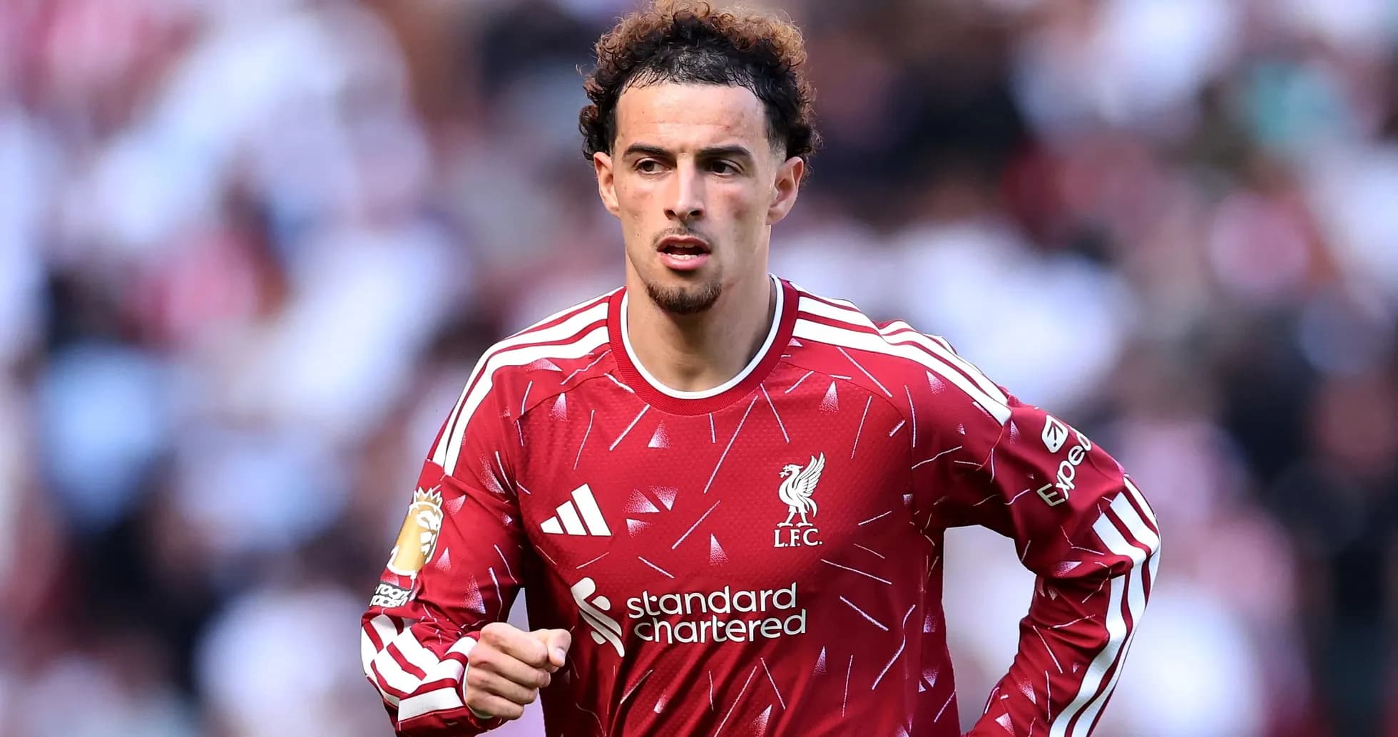Liverpool player running on the pitch during match Liverpool player running on the pitch during match