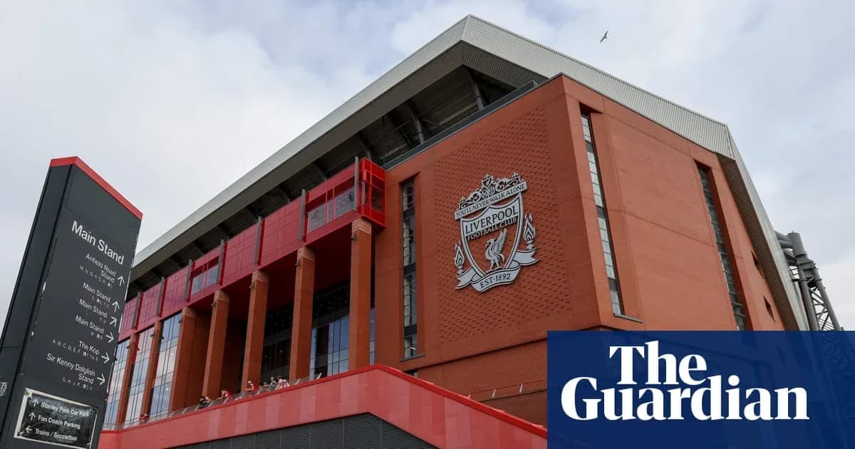 Exterior view of Anfield stadium with Liverpool FC crest Exterior view of Anfield stadium with Liverpool FC crest