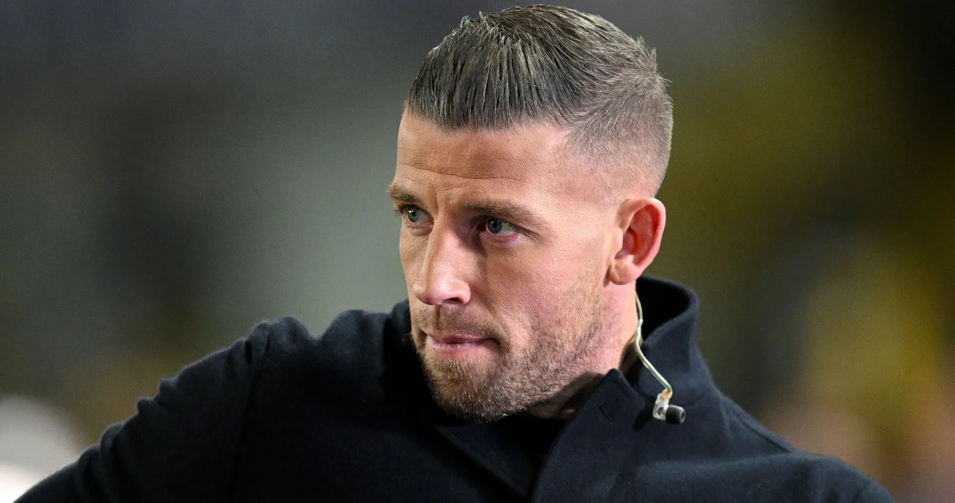 Man with short hair and beard looking thoughtfully Man with short hair and beard looking thoughtfully