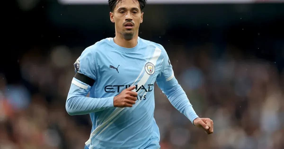 Player running on the pitch in Manchester City kit Player running on the pitch in Manchester City kit