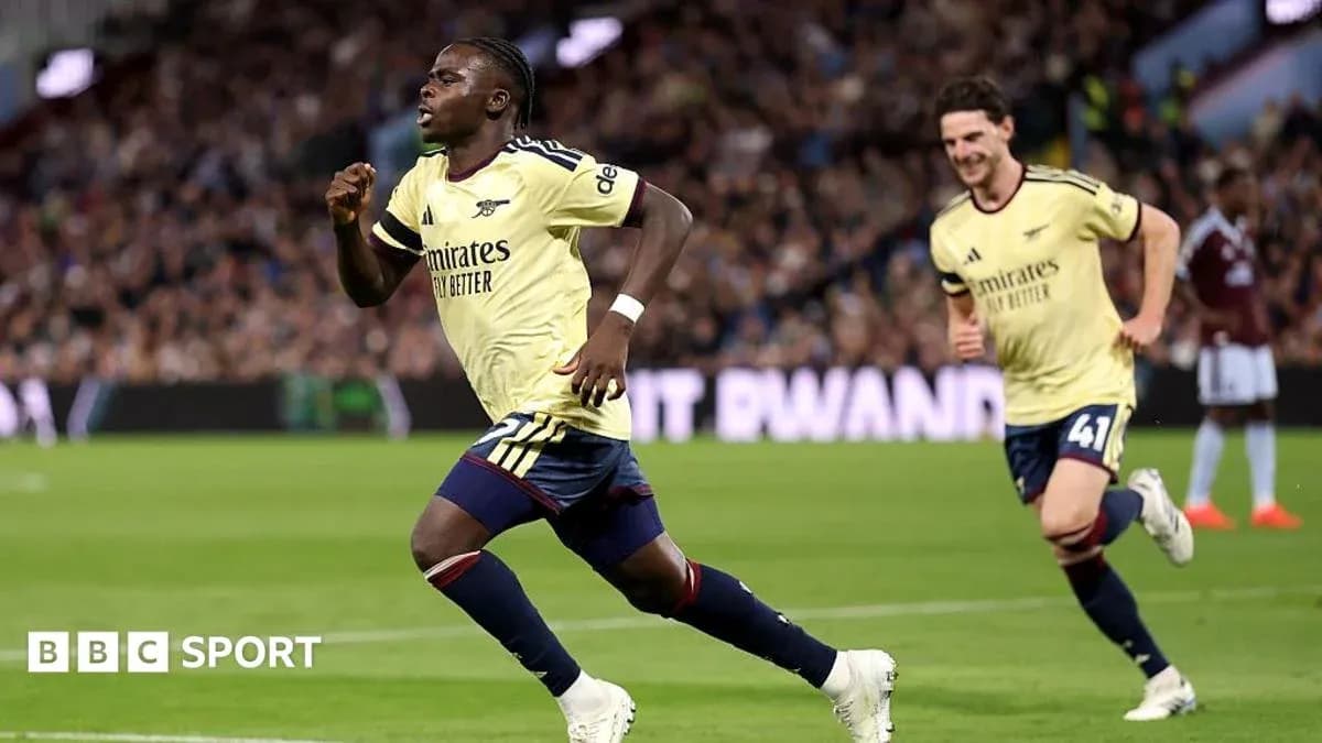 Player celebrating goal with teammate during match Player celebrating goal with teammate during match