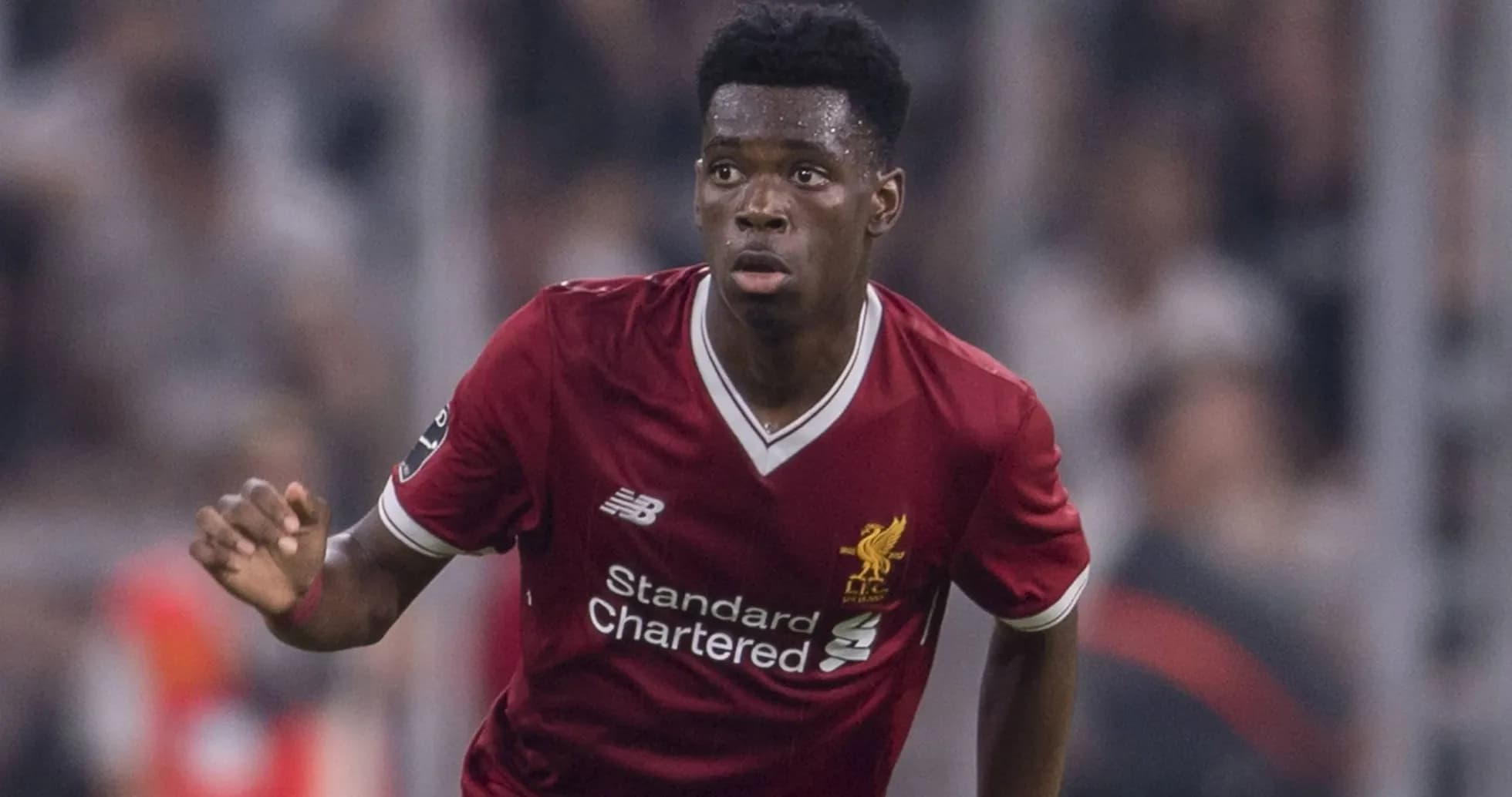 Player in Liverpool kit running during match Player in Liverpool kit running during match