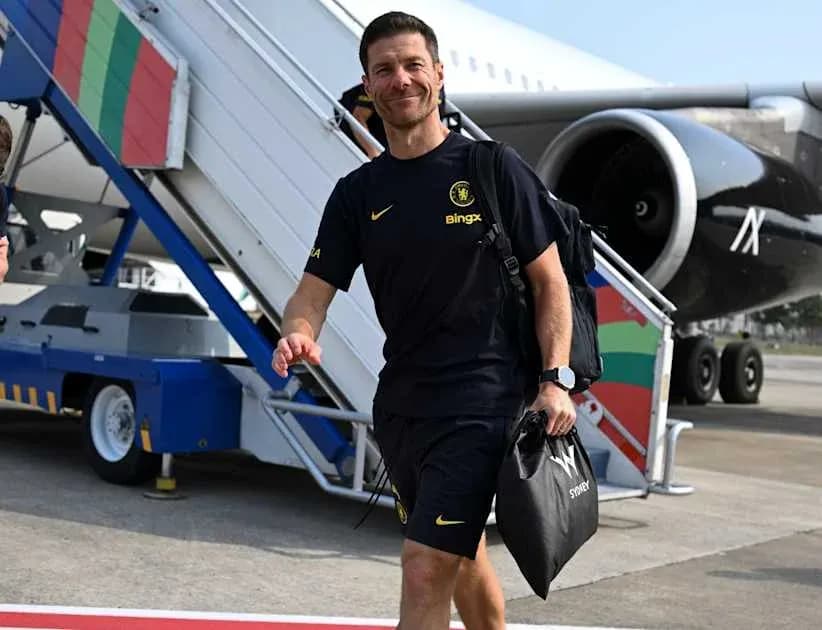 Man in sportswear walking towards airplane at airport Man in sportswear walking towards airplane at airport
