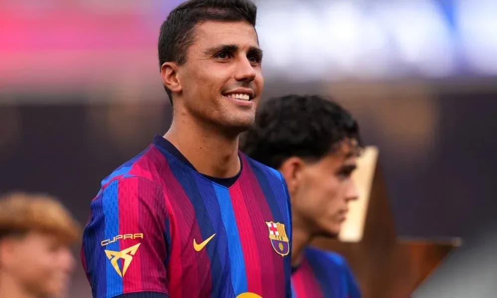 Player smiling in FC Barcelona jersey during event Player smiling in FC Barcelona jersey during event