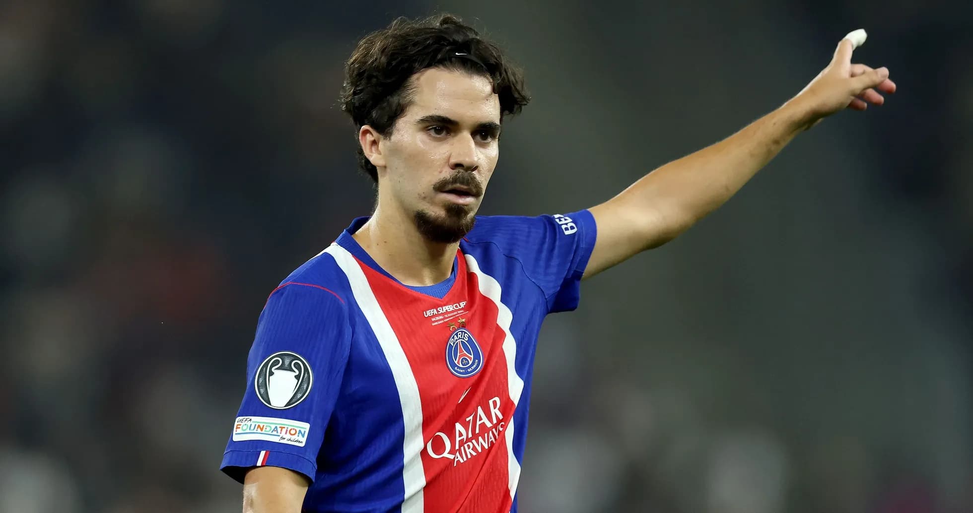 Player gesturing during a match wearing PSG jersey Player gesturing during a match wearing PSG jersey