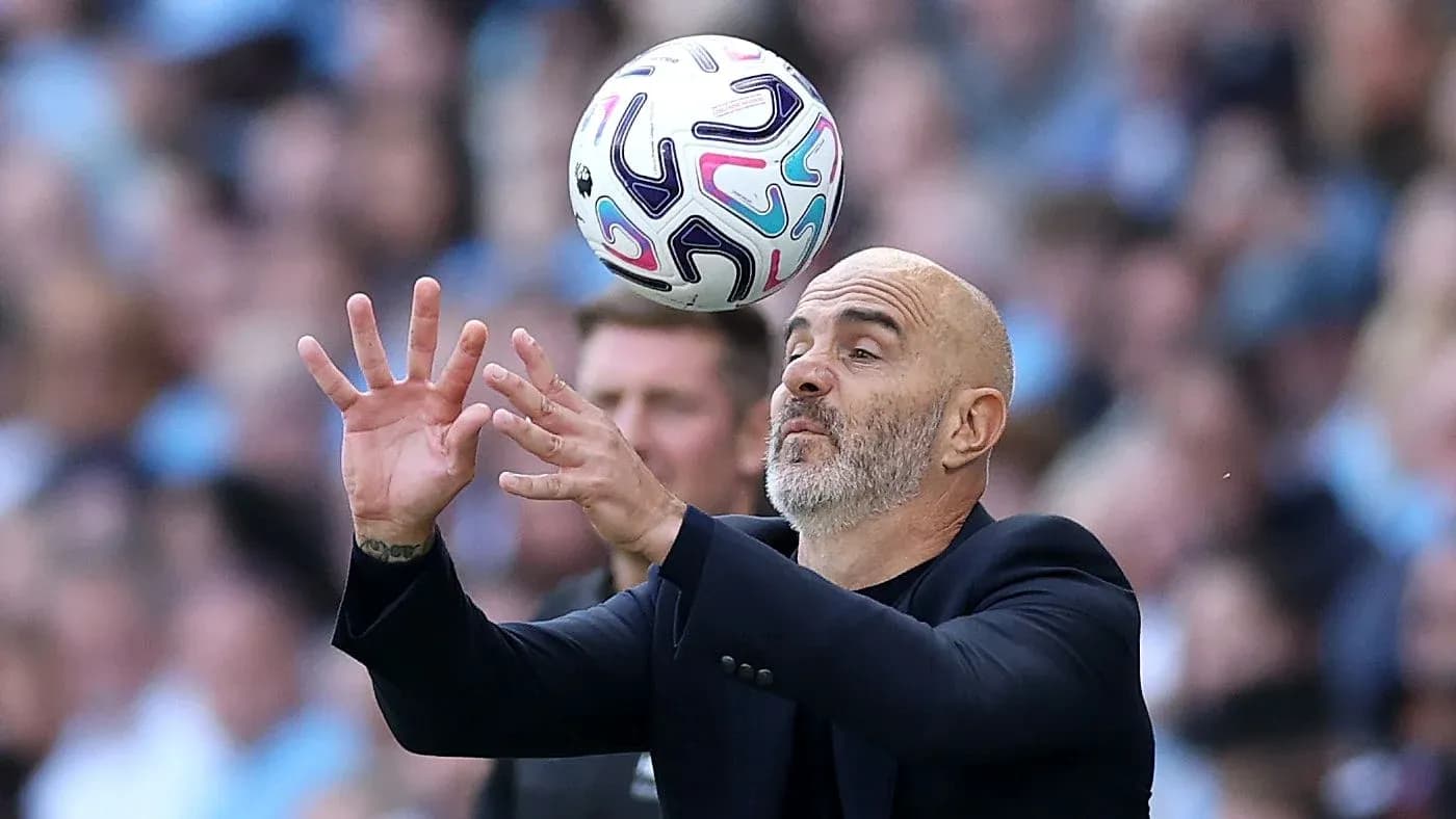 Coach attempting to catch a football during match Coach attempting to catch a football during match