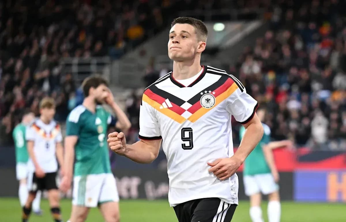 Player celebrating after scoring during a match Player celebrating after scoring during a match