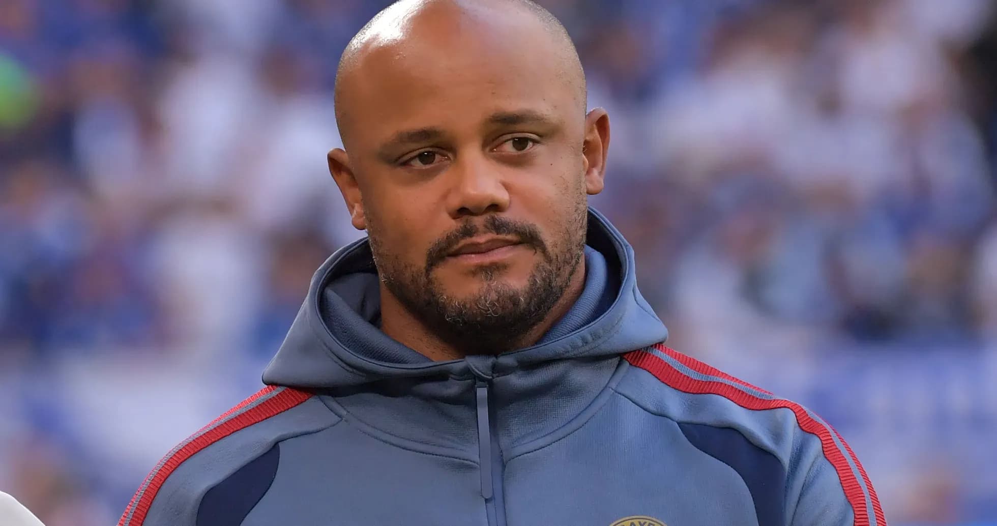 Man in gray hoodie standing on the field Man in gray hoodie standing on the field