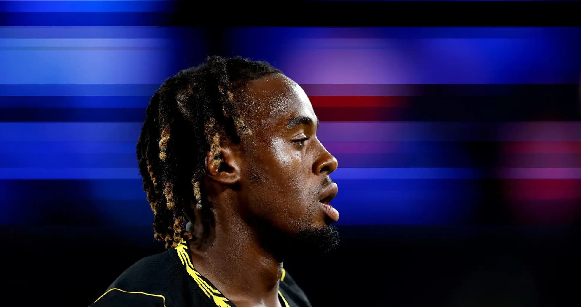 Athlete in profile against a blurred background Athlete in profile against a blurred background