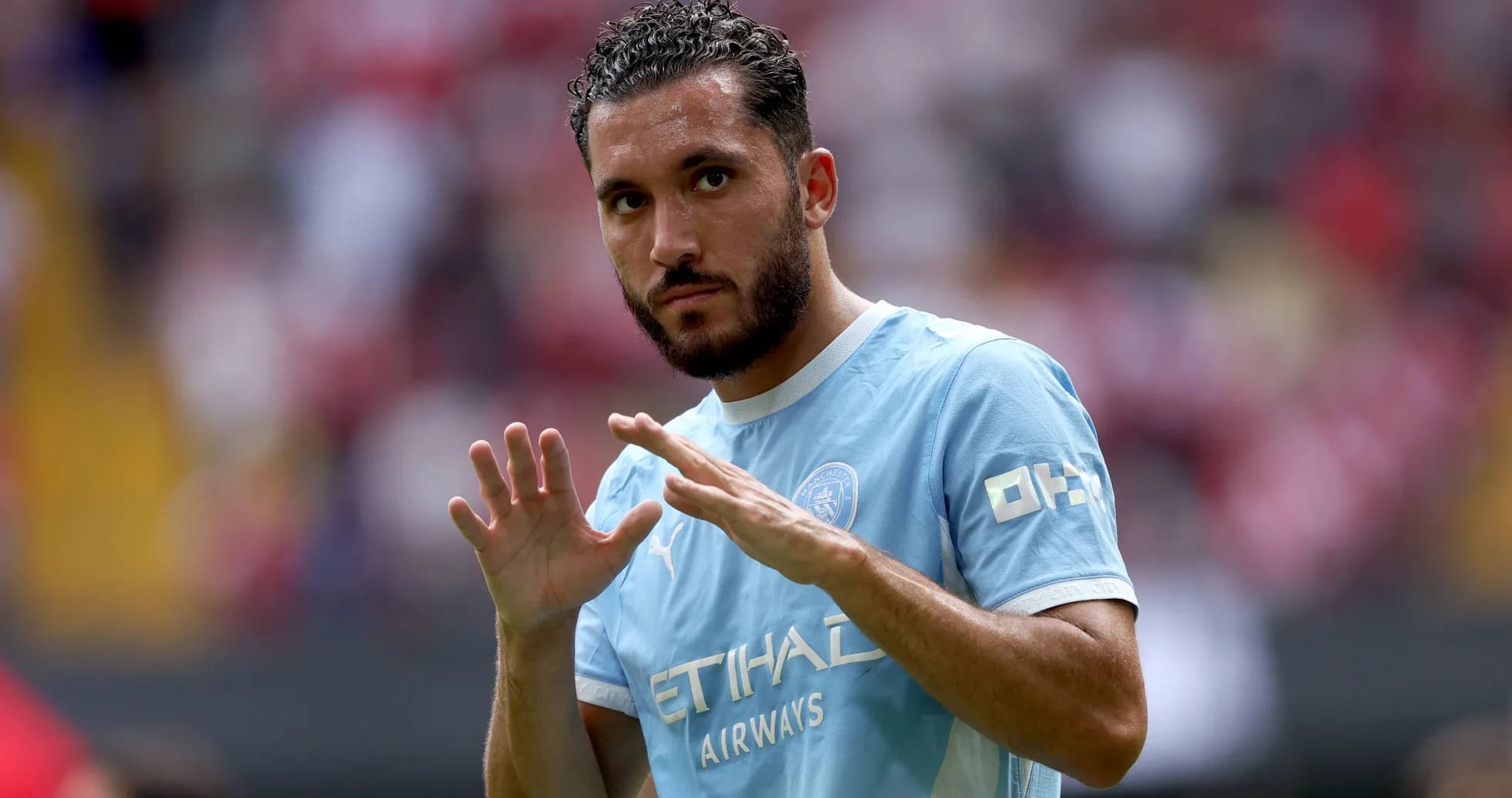 Player gesturing during match warm-up on field Player gesturing during match warm-up on field