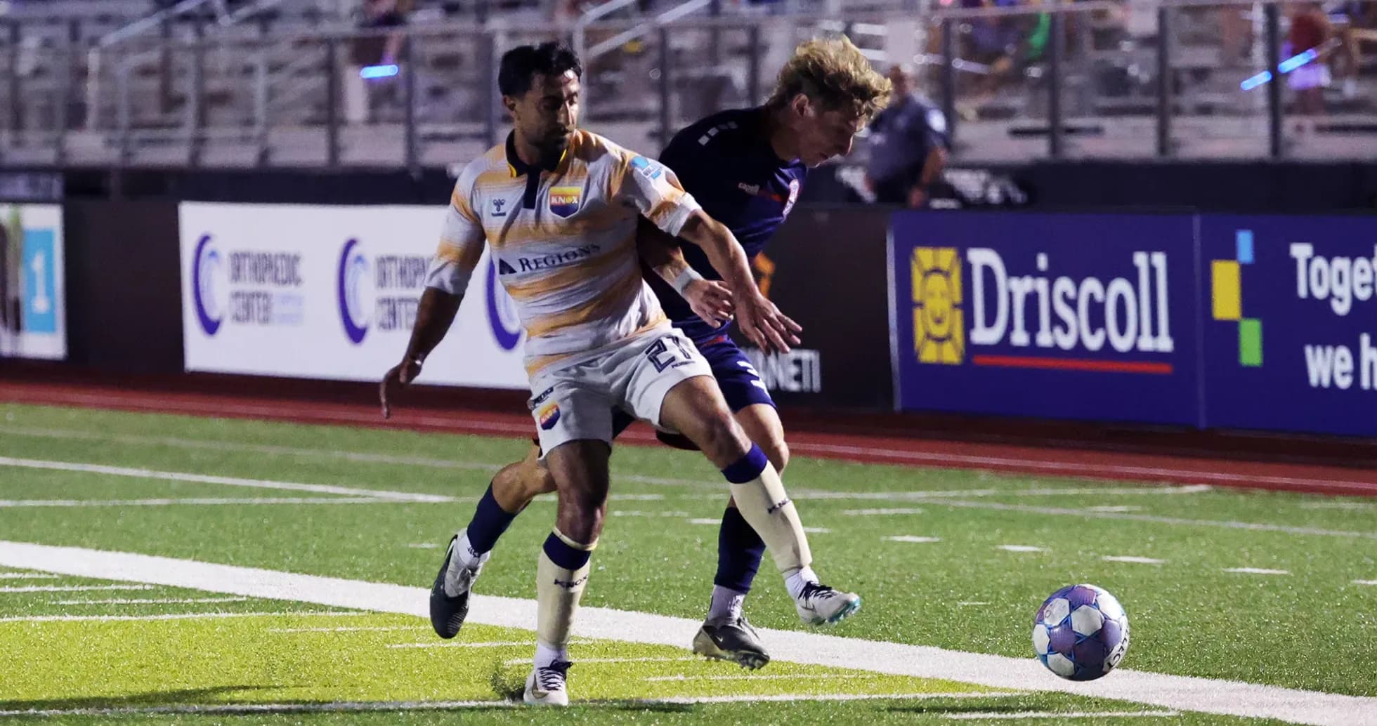 Player competing for the ball during match Player competing for the ball during match