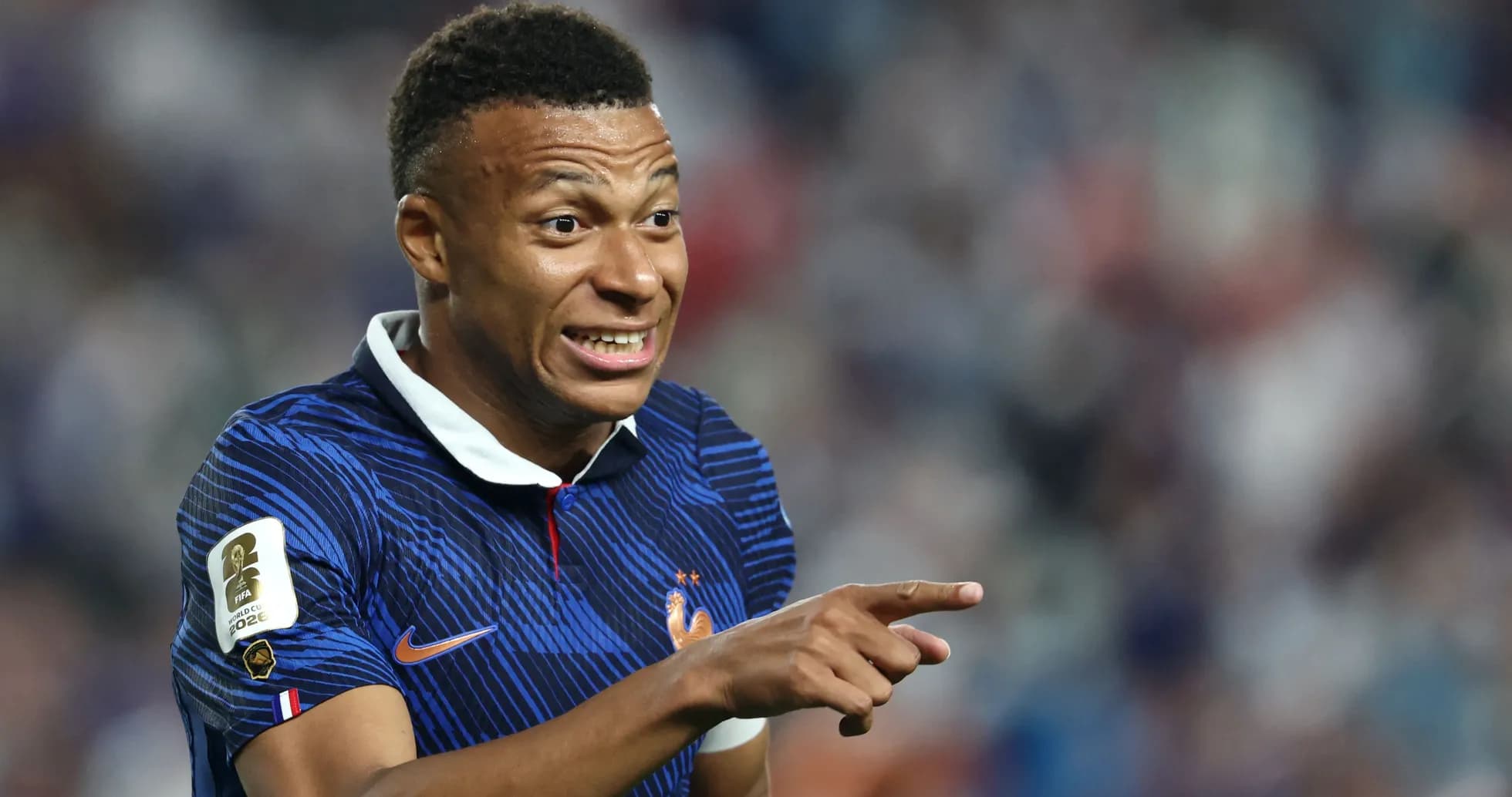 Player gesturing during a football match Player gesturing during a football match