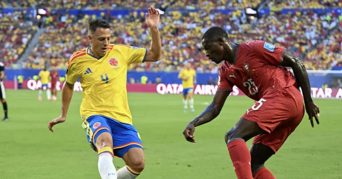Colombian and Moroccan players challenging for the ball Colombian and Moroccan players challenging for the ball