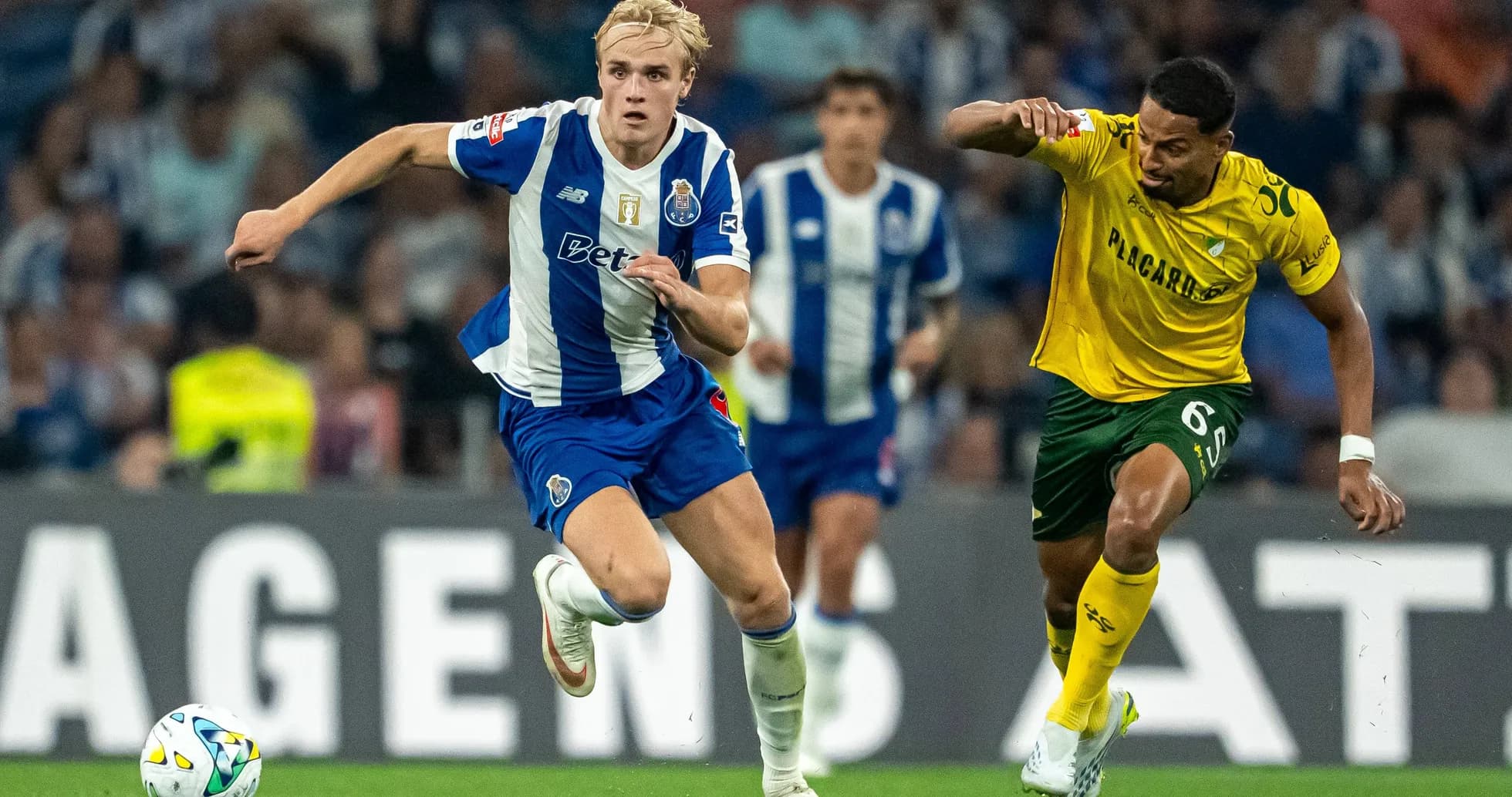 Player sprinting with ball during a match Player sprinting with ball during a match