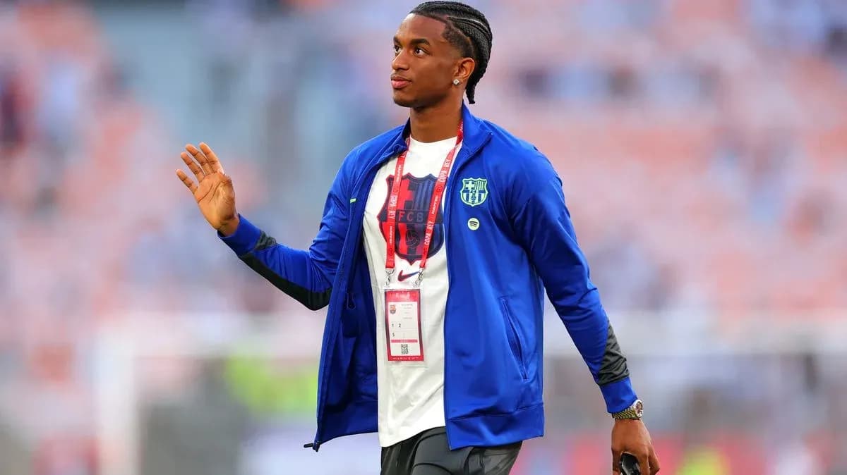 Player waving while walking in stadium before match Player waving while walking in stadium before match