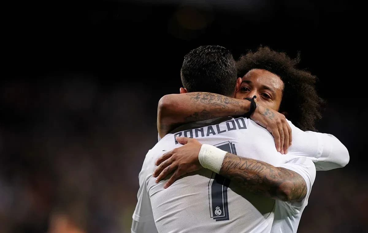 Players embracing during a match celebration Players embracing during a match celebration